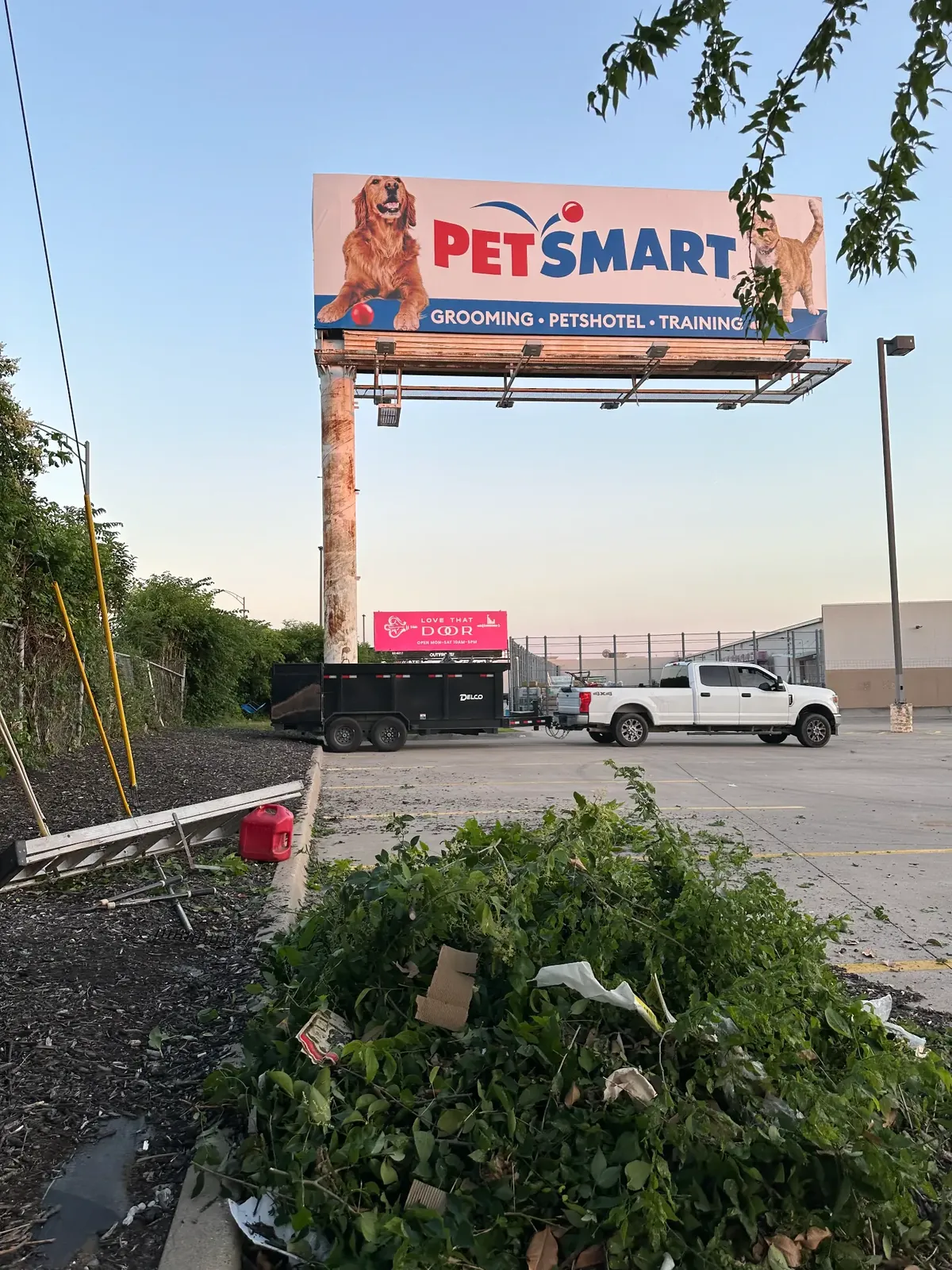 Bags of mulch staged at dusk so the crew could finish after the store closed