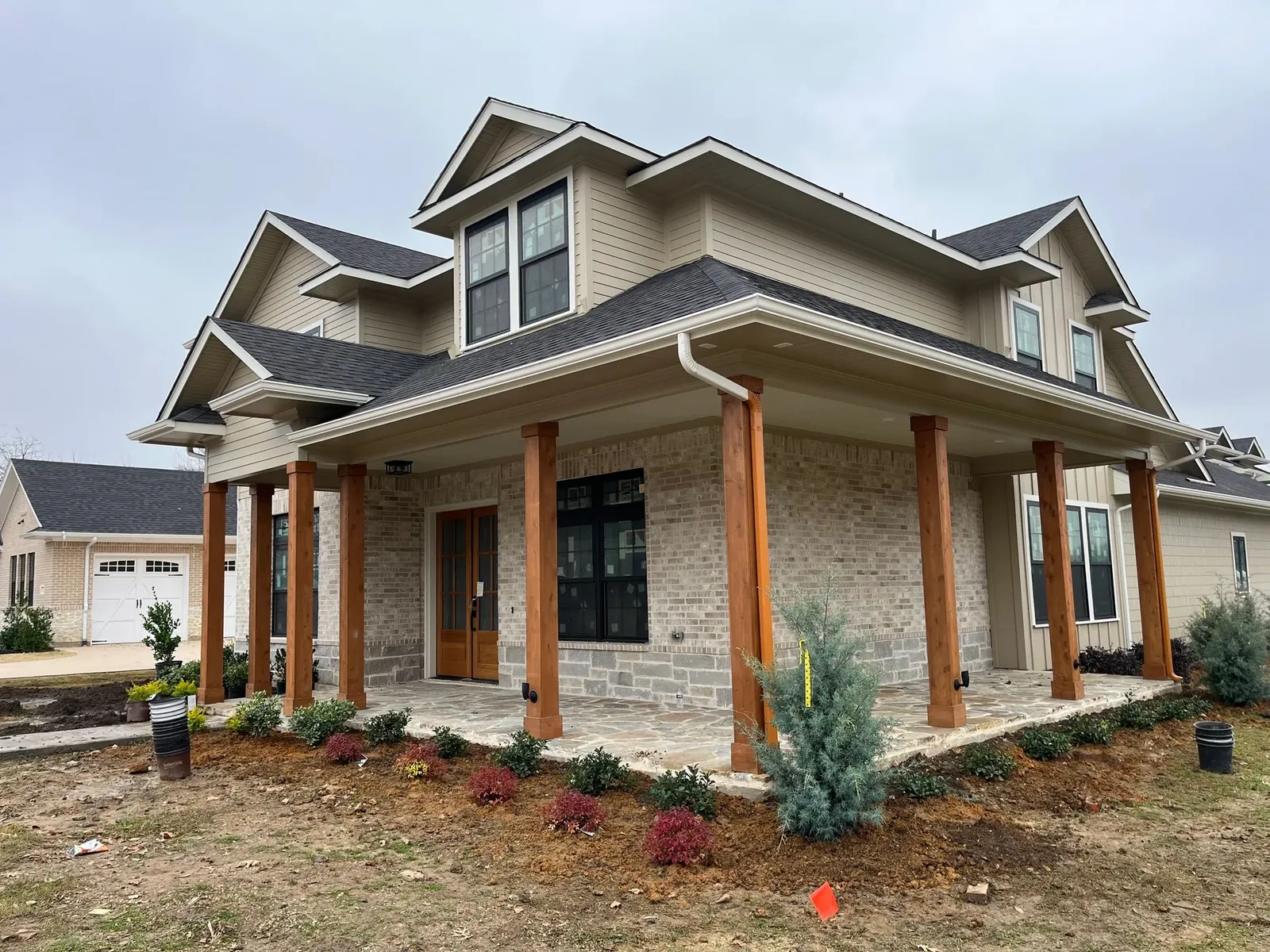 Front-yard beds and trimmed lawn on a brick home, Dallas TX