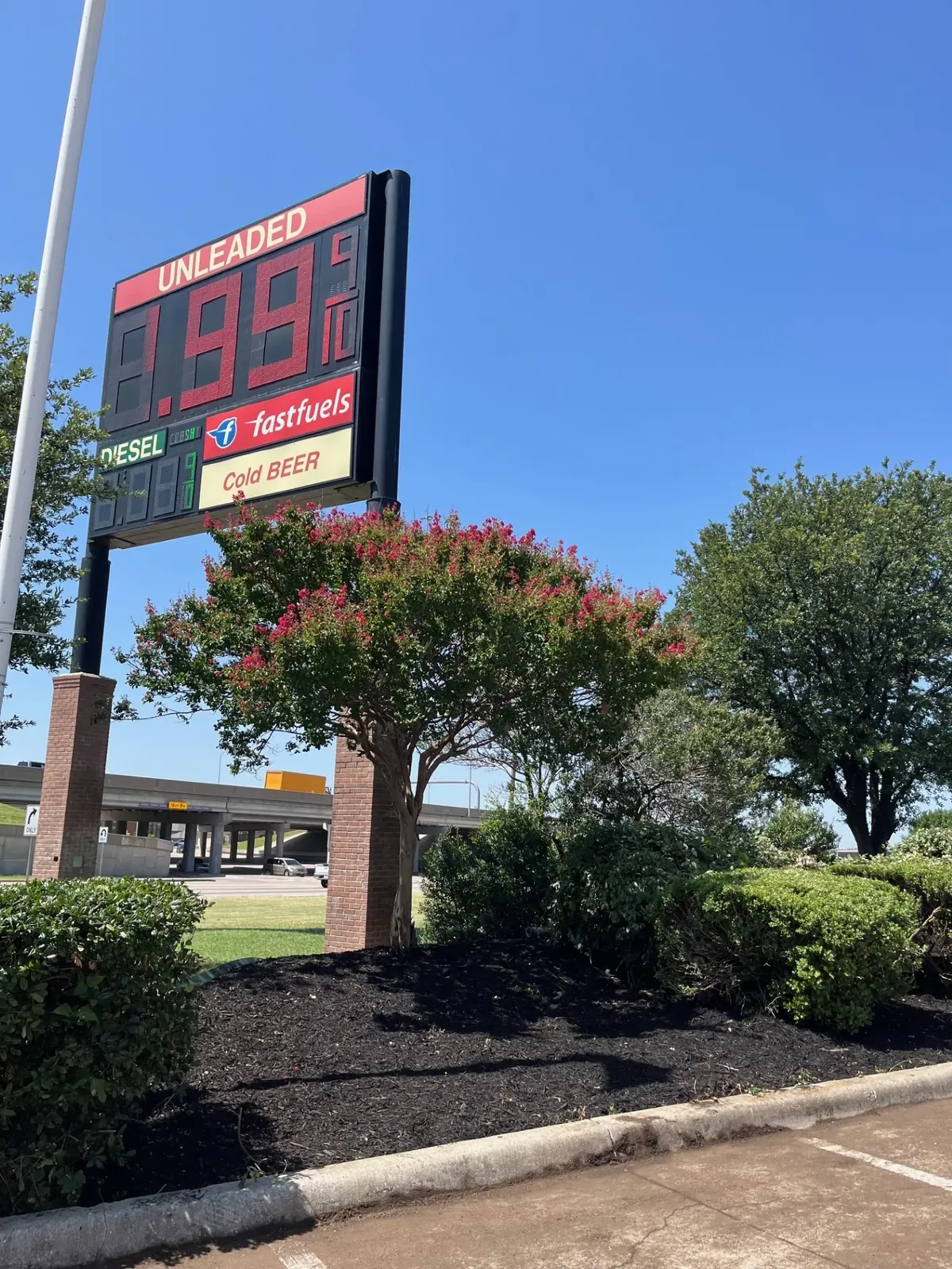 Gas station flowerbed, Godoy's Wolves LLC